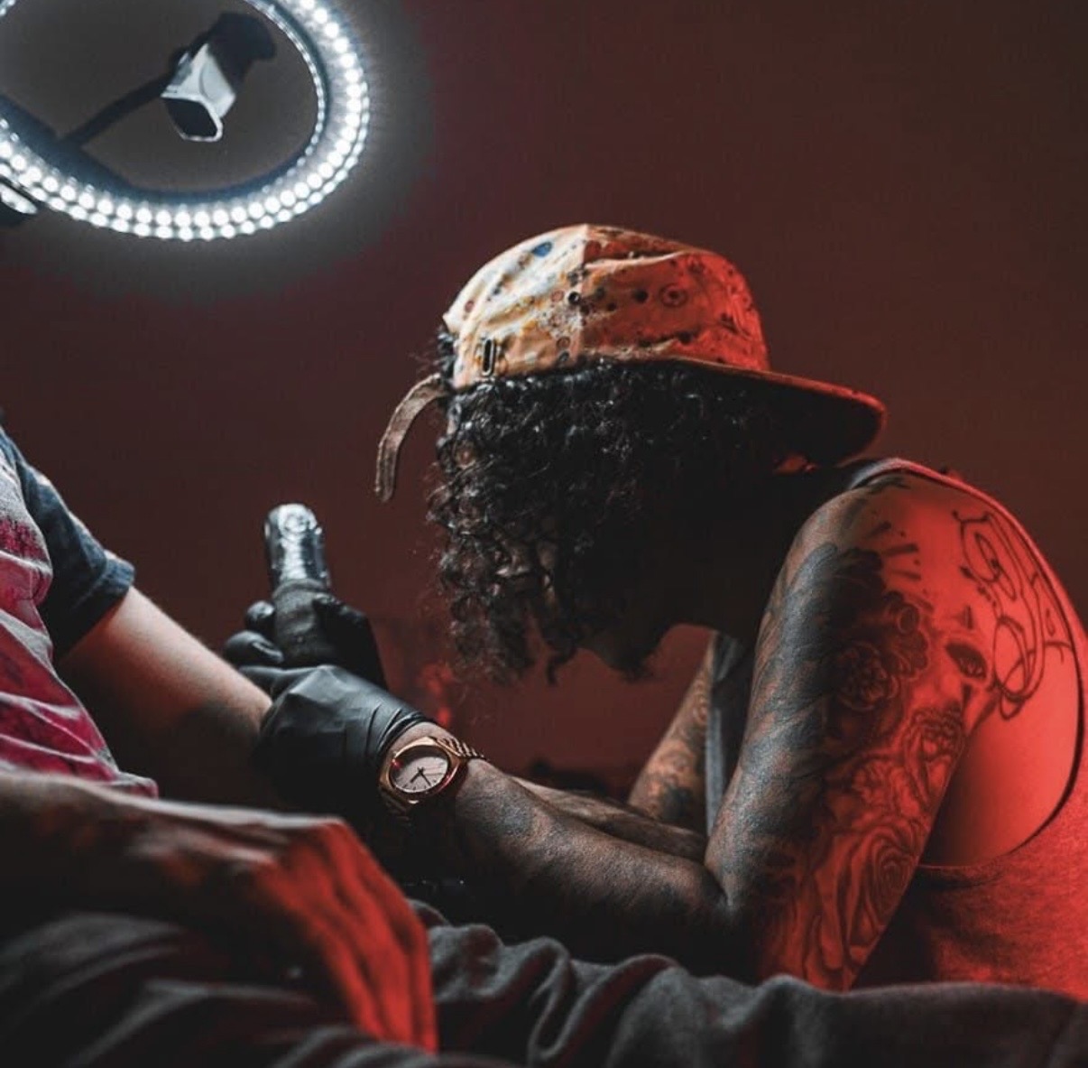 Fabian Gardeazabal tattooing a client at Hushtown Tattoos